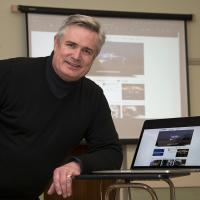 Andrew Barton with some of the images from his presentation